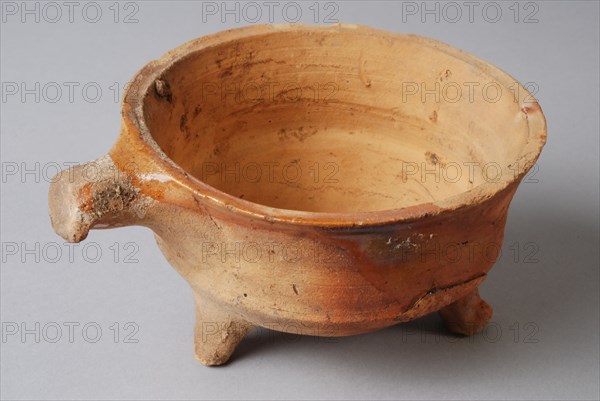 Pottery stem bowl, fire test, red shard with some tears lead glaze, short handle, on three legs, fire test bowl