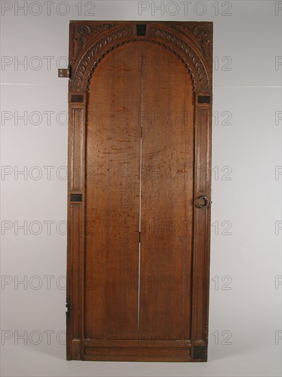Room door with carving, door building part oak wood iron, hinges and locks) sawn planed cut laid out Panel door with four cleats