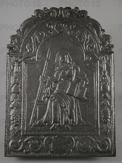 Fireback woman with cross and book, Fides, hob plate cast iron, cast Rectangular bow at the top on which two dolphins.