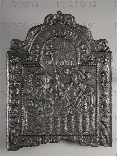 Fireplace Dutch Virgin in garden, and text Hollandia Pro Patria, hob plate cast iron, cast Rectangular bow at the top.