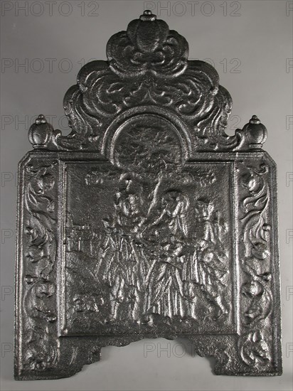 Fireback biblical performance Emmaus goers, hob cast iron, cast Rectangular bow at the top. On top of large ball leaf decoration