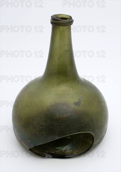 Green bell-shaped bottle, bottle bottle holder soil find glass, bottom. Body with convex wall with large hole and burst
