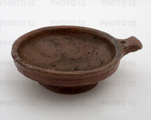 Pottery miniature saucepan or wine bowl with red shard and inside with lead glaze, short handle with hole and stand, saucepan