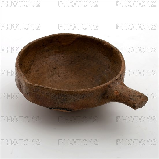 Pottery steel bowl or wine bowl with red shard and inside and outside edge covered with lead glaze with short handle and pouring