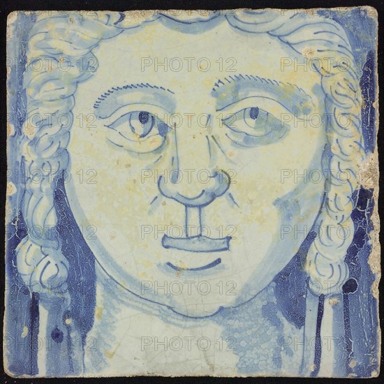 Tile of chimney pilaster, blue on white, head of woman with long curly hair, chimney pilaster tile pilaster footage fragment