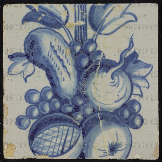 Tile of chimney pilaster, blue on white, part of up and down continuous representation with fruits, including pomegranate
