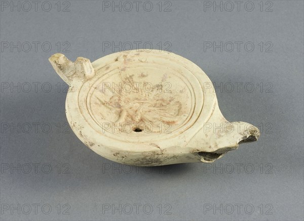 Lamp, 2nd/3rd century AD, Roman, Italy, terracotta, 3.8 × 8 × 12.5 cm (1 7/16 × 3 1/8 × 4 15/16 in.)