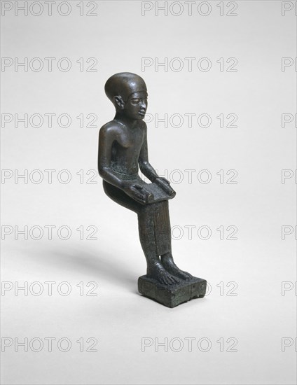 Statuette of Imhotep, Ptolemaic Period (305–30 BC), Egyptian, Egypt, Copper alloy, 12.5 × 3.75 × 6.5 cm (5 × 1 1/2 × 2 1/2 in.)