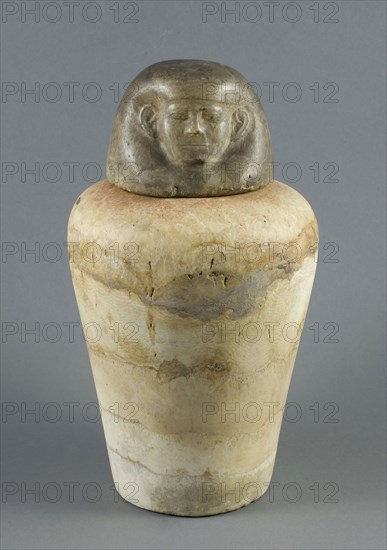 Canopic Jar with Human Head Lid, Middle Kingdom, Dynasty 12 (about 1985–1773 BC), Egyptian, Egypt, Stone, a (jar):  24.7 × 17.3 × 17.7 cm (9 ¾ × 7 × 7 in)