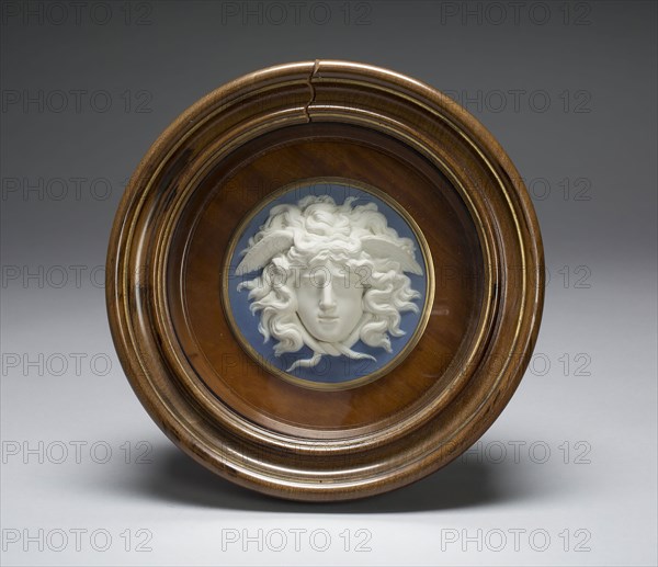 Medusa, 1775/80, Wedgwood Manufactory, England, founded 1759, Modeled by John Flaxman, Jr., English, 1755-1826, Etruria, Staffordshire, England, Etruria, Stoneware (jasperware), gilded wooden frame, 25.9 × 26 × 0.8 cm (10 3/16 × 10 1/4 × 5/16 in.)