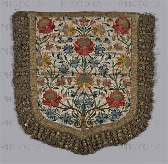 Hood of a Cope, 19th century, Spain, Silk in satin weave, lining is recent, braid in pattern in gilt metal and yellow silk floss, fringe of yellow silk wrapped with gilt metal with ornaments made of thin gauge metal in various shapes, embossed (brass color) over cardboard shapes padded with yellow silk floss, with edges formed of spiral gilt wires wired to gilt wrapped fiber cord, and additional ornaments of this construction and bowknots of wide "plate" wrapped around paper (?) core. Frisé holds ornaments together, braid and gilt-wrapped fiber used in pairs and gilt cord knotted in pattern hold groups of 4 ornaments in series, also: silk floss in color, silver frisé, stitches: satin (or float) long and short, stem, couching, outline, 60.6 x 61.3 cm (23 7/8 x 24 1/8 in.)