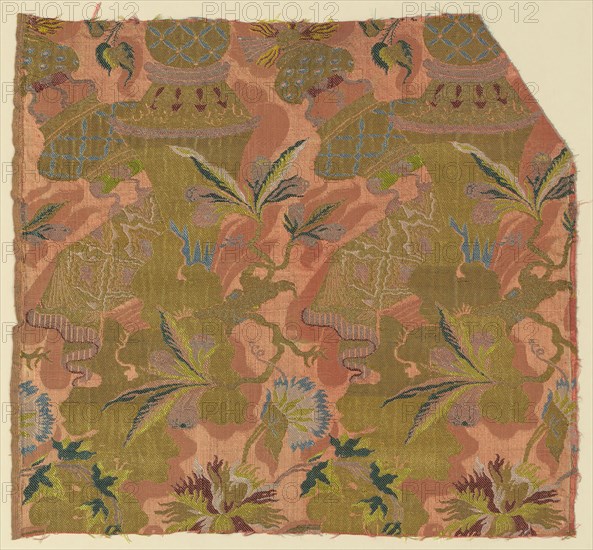 Fragment, c. 1705/06, France, Silk, gilt-and-silvered-metal-strip-wrapped silk, warp-float faced 7:1 satin weave with supplementary patterning wefts, supplementary brocading wefts, and self-patterned by areas of plain weave, 47.9 × 51.7 cm (18 7/8 × 20 3/8 in.)