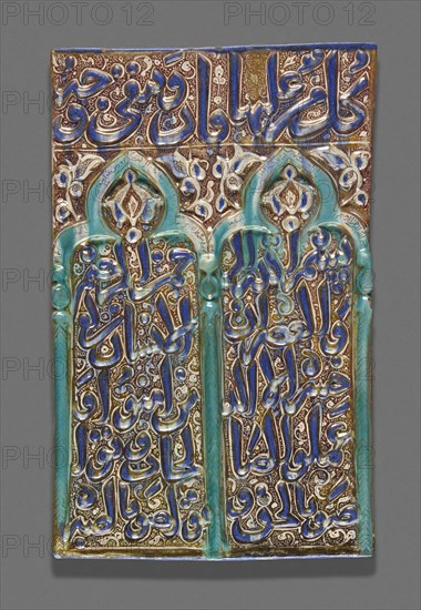 Tile with Double-Arched Prayer Niche (Mihrab), Ilkhanid dynasty (1256–1353), 13th century, Iran, probably Kashan, Iran, Fritware with molded decoration, in-glaze painting in cobalt-blue and turquoise, and overglaze painting in luster, 50.8 × 31.9 cm (20 × 12 9/16 in.)