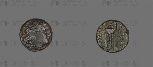 Coin Depicting the God Apollo, 316/297 BC, issued by Cassander, Greek, Greece, Bronze, Diam. 1.8 cm, 6.23 g