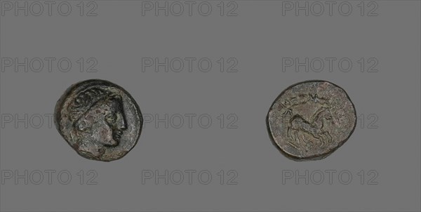 Coin Depicting the God Apollo (?), 336/323 BC, Greek, Greece, Bronze, Diam. 1.7 cm, 4.15 g