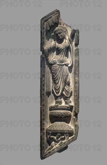 A Yakshi Grasping a Tree, Kushan period, 2nd/3rd century, Pakistan, Khyber Pakhtunkhwa Province, Ancient region of Gandhara, Gandhara, Gray schist, 96.5 × 24.5 × 10.8 cm (38 × 9 5/8 × 4 1/4 in.)