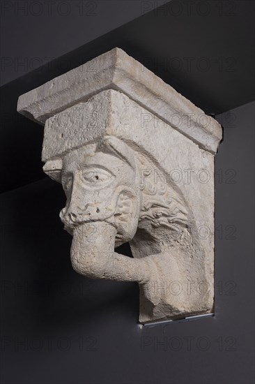 Corbel with Animal Mask with Teeth Fastened on Human Leg from the Monastery Church of Notre-Dame-de-la-Grande-Sauve, 1150/1200, French, Aquitaine, Limestone, 45.7 × 31.8 × 59.7 cm (18 × 12 1/2 × 23 1/2 in.)