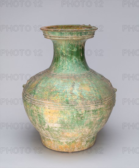 Globular Jar with Mock Ogre Mask Ring Handles, Han dynasty (206 B.C.–A.D. 220), China, Earthenware with underglaze molded decoration and lead green glaze, H. 39.1 cm (15 3/8 in.), diam. 30.7 cm (12 1/8 in.)