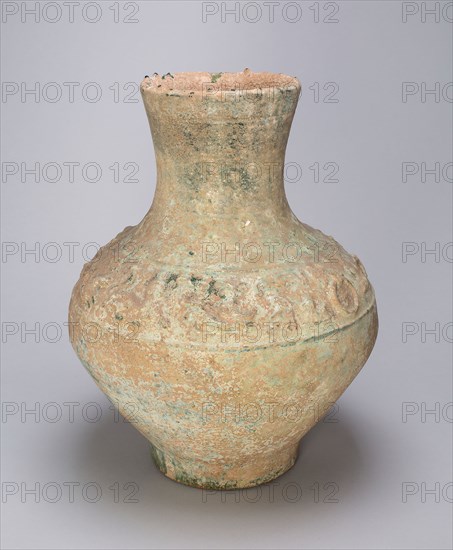 Storage Jar (Hu) with Hunting Scenes, Eastern Han dynasty (A.D. 25–220), China, Earthenware with underglaze molded decoration and green lead glaze, H. 37.6 cm (14 13/16 in.), diam. 29.5 cm (11 5/8 in.)