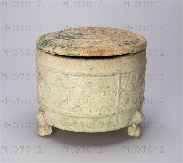 Tripod Cylindrical Jar (Lian or Zun) with Equestrians and Creatures, Bear-Shaped Feet, Eastern Han dynasty (A.D. 25–220), China, Earthenware with lead green glaze, H. with lid: 18.7 cm (7 3/8 in.), diam. 19.7 cm (7 3/4 in.)