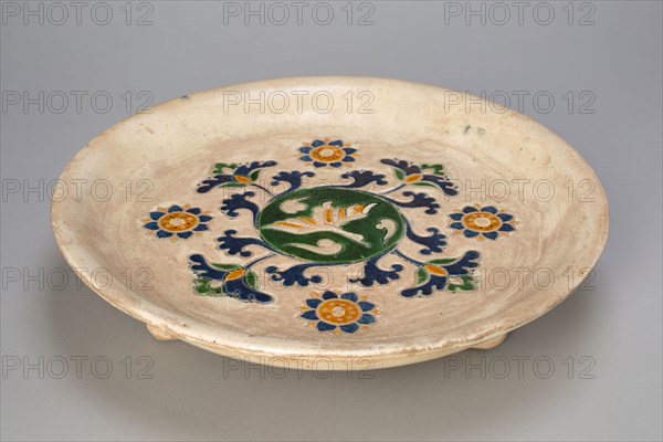 Tripod Dish with Flying Goose, Stylized Flowers and Vines, Tang dynasty (618–907), China, Slip-coated earthenware with three-color (sancai) lead glazes and underglaze mold-impressed decoration, H. 6.5 cm (2 9/16 in.), diam. 29.3 cm (11 9/16 in.)