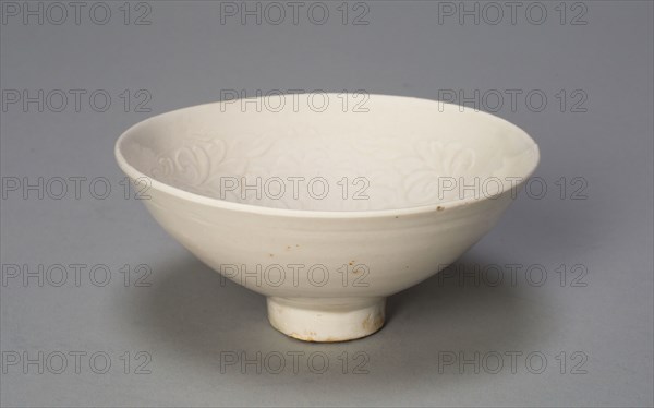 Conical Bowl with Peonies and Leaves, Song dynasty (960–1279), China, Ding ware, porcelain with underglaze molded decoration, H. 4.7 cm (1 7/8 in.), diam. 10.3 cm (4 1/16 in.)