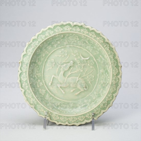 Foliate Dish with Bovine (Xiniu) Gazing at a Crescent Moon, Yuan dynasty (1279–1368), late 13th century, China, Longquan ware, stoneware with underglaze molded decoration, H. 3.5 cm (1 3/8 in.), diam. 16.2 cm (6 in.)
