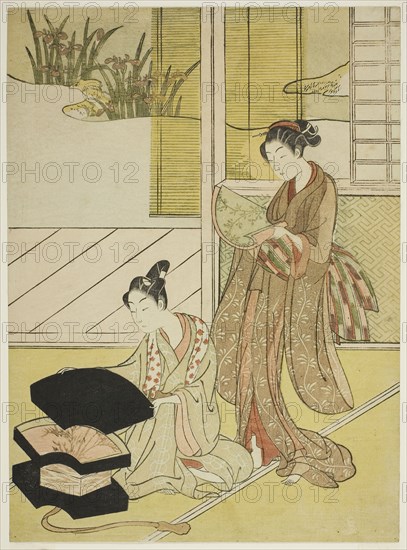 A Fan Peddler Showing his Wares to a Young Woman, c. 1765/70, Attributed to Suzuki Harunobu ?? ??, Japanese, 1725 (?)-1770, Japan, Color woodblock print, chuban, 27.5 x 20.2 cm