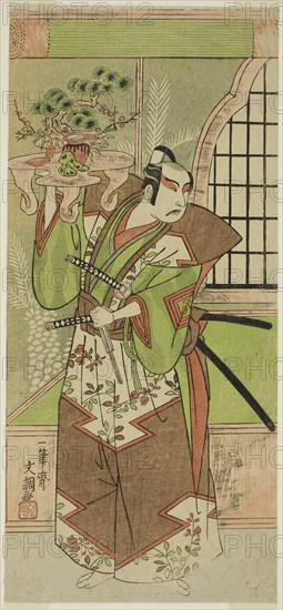 The Actor Ichikawa Yaozo II in a pre-performance celebration of the play Soga Monogatari, performed at the Morita Theater in the second month, 1773, 1773, Ippitsusai Buncho, Japanese, active c. 1755-90, Japan, Color woodblock print, left sheet of hosoban triptych, 30.2 x 13.7 cm (11 7/8 x 5 3/8 in.)