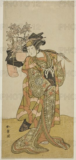 The Actor Yamashita Kinsaku II as Odai, an Eboshi (Hat) Seller, in the Play Hana-zumo Genji Hiiki, Performed at the Nakamura Theater in the Eleventh Month, 1775, c. 1775, Katsukawa Shunsho ?? ??, Japanese, 1726-1792, Japan, Color woodblock print, hosoban, 32.8 x 14.8 cm (12 15/16 x 5 13/16 in.)