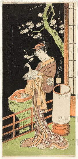 The Actor Segawa Kikunojo II as Oiso no Tora in the Play Soga Moyo Aigo no Wakamatsu, Performed at the Nakamura Theater in the First Month, 1769, c. 1769, Ippitsusai Buncho, Japanese, active c. 1755-90, Japan, Color woodblock print, hosoban, 30.3 x 14.6 cm (11 15/16 x 5 3/4 in.)
