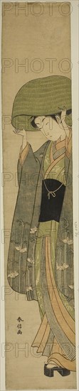 The Basket Hat, c. 1768/69, Suzuki Harunobu ?? ??, Japanese, 1725 (?)-1770, Japan, Color woodblock print, hashira-e, 26 3/4 x 4 7/8 in.