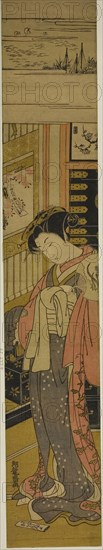 The Courtesan Kaoru of Chojiya Looking Down at a Love Letter on the Floor, c. 1773/75, Isoda Koryusai, Japanese, 1735-1790, Japan, Color woodblock print, hashira-e, 26 3/8 x 4 5/8 in.
