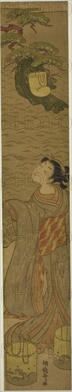 Parody of Matsukaze dancing beneath Yukihira’s robe, c. 1771, Isoda Koryusai, Japanese, 1735-1790, Japan, Color woodblock print, hashira-e, 26 3/8 x 4 5/8 in.