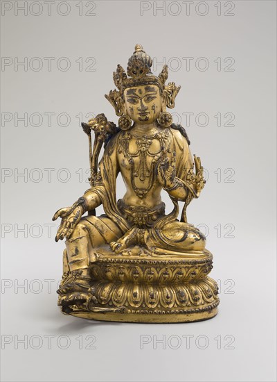 Green Tara, Seated in Pose of Royal Ease (Lalitasana), with Lotus Stalks on Right Shoulder and Hands in Gestures of Reasoning (Vitarkamudra) and Gift Conferring (Varadamudra), Ming dynasty (1368–1644), Yongle reign mark and period (1403–24), China, Gilt copper alloy with traces of pigment (lapis lazuli), 21.5 × 13.5 × 12.5 cm (8 1/2 × 5 1/4 × 4 7/8 in.)