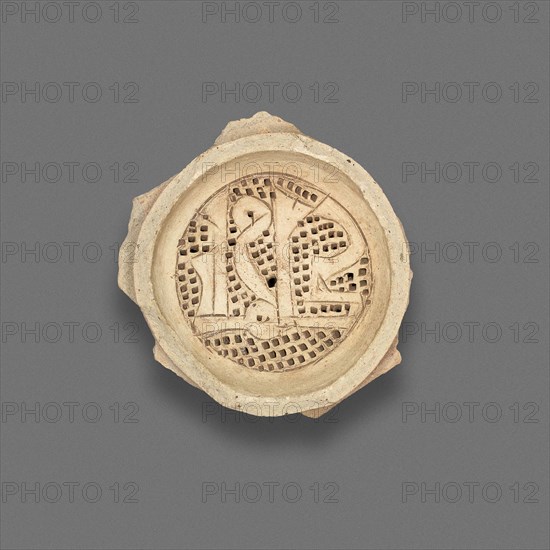 Clay filter with callegraphic design, Fatimid dynasty (969–1171), 11th–12th century, Egypt, Fustat, Masr al-`Atiqah, Earthenware, carved and punched, .75 × 6.7 × cm (3/4 × 2 5/8 in.)