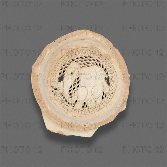 Clay filter with design of elephant, Fatimid dynasty (969–1171), 11th–12th century, Egypt, Fustat, Masr al-`Atiqah, Earthenware, carved and punched, 2.5 × 7.9 cm (1 × 3 1/8 in.)