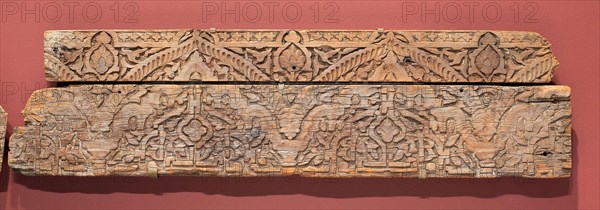 Fragment of an architectural molding, Marinid dynasty (1244–1465), 14th century, Morocco, Morocco, Wood with relief carving, a: 12.0 x 115.5 x 4.5 cm (4 3/4 x 45 1/2 x 1 3/4 in.), b: 21.1 x 126.0 x 5.5 cm (8 5/16 x 49 5/8 x 2 3/16 in.)