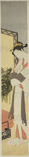Courtesan Standing by Screen and Bed, c. 1768/69, Suzuki Harunobu ?? ??, Japanese, 1725 (?)-1770, Japan, Color woodblock print, hashira-e, 26 5/8 x 4 5/8 in.