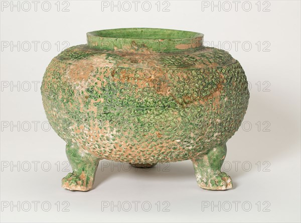 Tripod Jar, Tang dynasty (618–906), China, Stoneware with underglaze molded decoration and green glaze, H. 16.7 cm (6 5/8 in.), diam. 23.0 cm (9 1/16 in.)