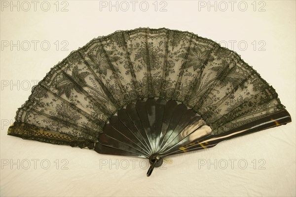 Fan, 1870/1890, France, tortoiseshell(?), ribs, slips, and guardsticks, silk, bobbin lace, lined with silk, gauze weave, 30.48 × 53.34 cm (12 × 21 in.)