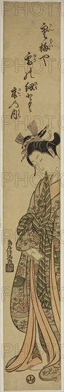 Young woman holding obi between her teeth, c. 1760/64, Torii Kiyomitsu I, Japanese, 1735-1785, Japan, Color woodblock print, hashira-e, benizuri-e, 68.3 x 10.2 cm (26 7/8 x 4 in.)