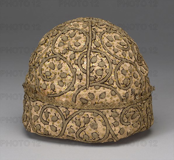 Man’s Cap, 1575/1600, England, Linen, plain weave, embroidered with silk, gilt-strip-wrapped silk, and metal paillettes in ladder and stem stitches, couching and buttonholed couching, edged with bobbin lace, 18 × 19 cm (7 × 7 1/2 in.)