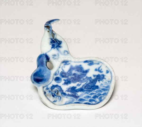 Gourd-Shaped Plaque with Dragon Rising from Waves, Qing dynasty (1644–1911), Qianlong period (1736–1795), China, Porcelain painted in underglaze blue, 1.0 × 6.6 × 8.8 cm (3/8 × 2 5/8 × 3 7/16 in.)