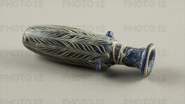 Bottle, Hellenistic, 2nd/1st century BC, Eastern Mediterranean, Egypt, Glass, core-formed technique, 12.1 × 4.1 × 3.2 cm (4 3/4 × 1 5/8 × 1 1/4 in.)