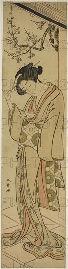 Woman on a Veranda About to Open a Love-letter, mid–late 1770s, Katsukawa Shunsho ?? ??, Japanese, 1726-1792, Japan, Color woodblock print, wide hashira-e, 69 x 16.7 cm (27 1/8 x 6 9/16 in.)