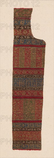 Fragment, 15th century, Andalucia, Spain, Andalucia, Silk and gilt-metal-strip-wrapped silk, satin weave with secondary binding warps and supplementary patterning wefts, 45.5 × 10.3 cm (17 7/8 × 4 1/8 in.)