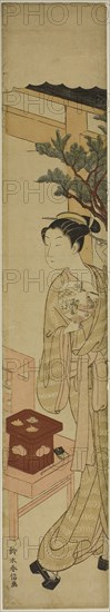 The Waitress Osen of the Kagiya Teahouse Holding a Fan, c. 1768/69, Suzuki Harunobu ?? ??, Japanese, 1725 (?)-1770, Japan, Color woodblock print, hashira-e, 25 5/16 x 4 3/4 in.
