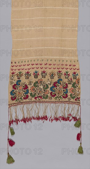 Towel, 18th century, Greece, Northern Sporades Islands, Lesbos, Mytilene, Mytilene, Linen and silk, plain weave self patterned by ground weft floats, embroidered with silk and gilt-metal-strip-wrapped silk in Bosnian, flat, double running, running (pattern darning) twined double running, and satin stitches, edged with plied warp fringe with silk and gilt-metal-strip-wrapped silk tassels, 252.2 x 39.3 cm (99 1/4 x 15 1/2 in.)