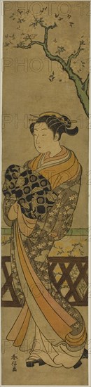 Courtesan Parading Beneath Cherry Tree, c. 1769/70, Suzuki Harunobu ?? ??, Japanese, 1725 (?)-1770, Japan, Color woodblock print, hashira-e, 21 1/4 x 4 7/8 in.